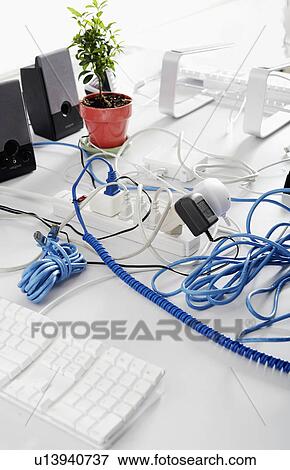 Stock Photo - Computer Leads and Cables on Table. Fotosearch