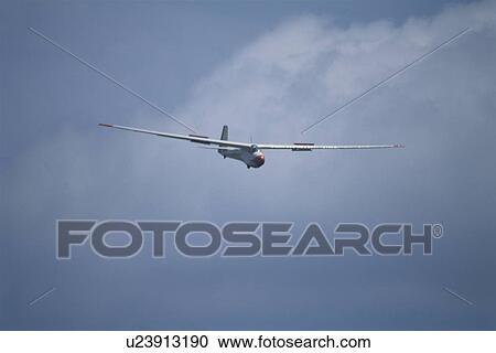 Stock Image - Glider Which Flies In The Sky. Fotosearch