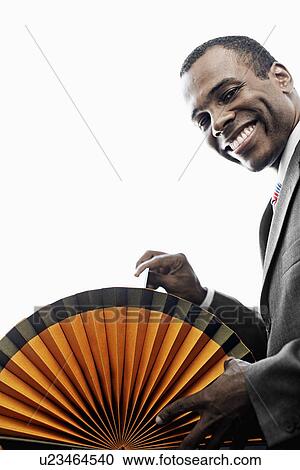 Mid Adult Man Going Through Rotary File View Large Photo Image Stock Image - Mid Adult Man Going Through Rotary File. Fotosearch