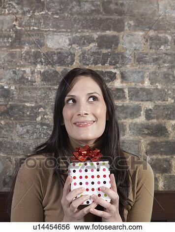 Mid-Adult Woman Holding Gift View Large Photo Image Stock Photograph - Mid-Adult Woman Holding Gift. Fotosearch