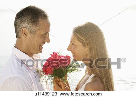 Newlyweds on beach View Large Photo Image Stock Image - Newlyweds on beach. Fotosearch