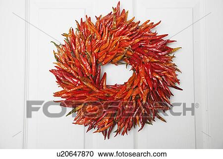Stock Image - Wreath made of dried chillies. Fotosearch