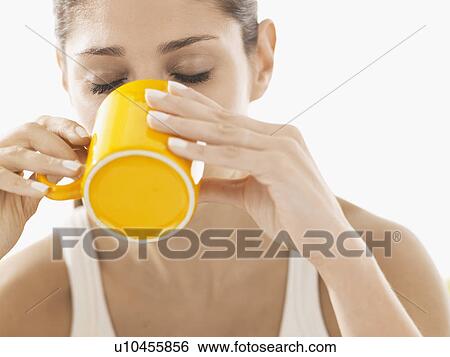 Young woman drinking coffee View Large Photo Image Stock Photograph - Young woman drinking coffee. Fotosearch