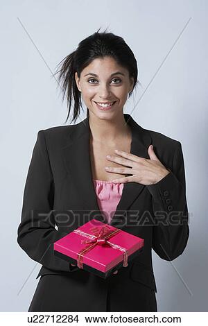 Picture - Young woman with gift. Fotosearch