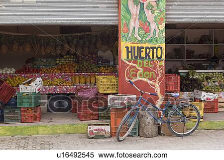 Stock Photography - Bike in front of an open market. Fotosearch
