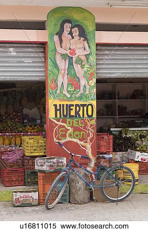Stock Photography - Bike in front of an open market. Fotosearch