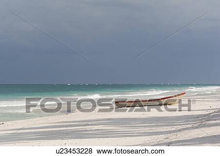 Stock Photo - Boat on Shoreline in Tulum Mexico. Fotosearch