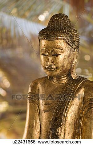Stock Photograph - Buddha statue in Tulum Mexico. Fotosearch
