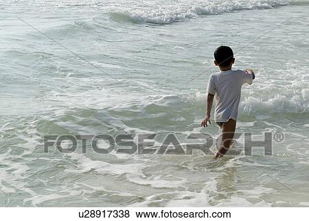 Child running in the ocean View Large Photo Image Stock Photo - Child running in the ocean. Fotosearch
