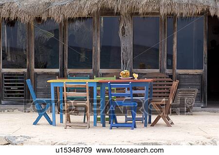 Colourful tables and chairs in Tulum Mexico View Large Photo Image Stock Photo - Colourful tables and chairs in Tulum Mexico. Fotosearch