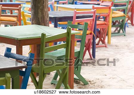 Stock Photo - Colourful tables and chairs in Tulum Mexico. Fotosearch