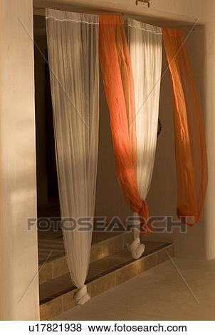 Drapery in a window opening View Large Photo Image Stock Photo - Drapery in a window opening. Fotosearch