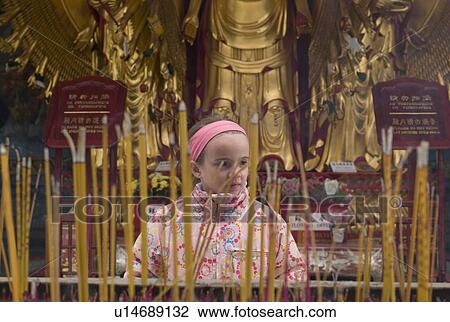 Stock Image - Girl infront of inscents. Fotosearch