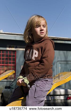 Girl riding a teeter totter View Large Photo Image Picture - Girl riding a teeter totter. Fotosearch