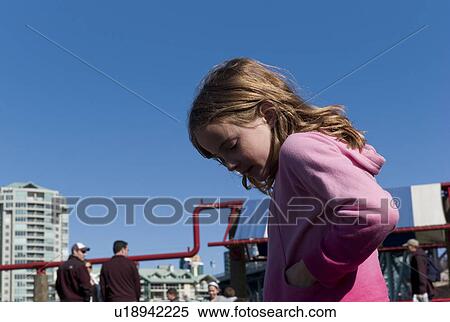 Stock Photography - Girl with hand in her pocket. Fotosearch