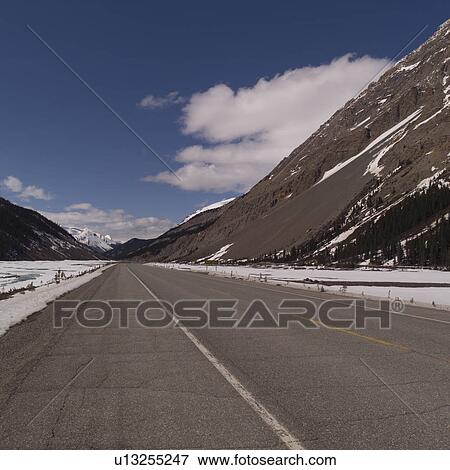 Stock Photo - Highway through the Rocky Mountains. Fotosearch
