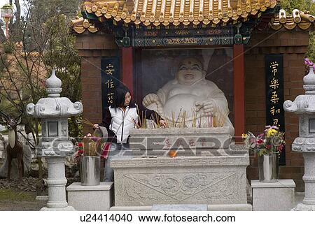 Lady infront of a Budda View Large Photo Image Stock Image - Lady infront of a Budda. Fotosearch