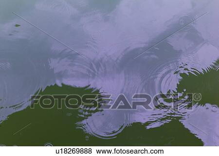 Stock Photo - Reflection of clouds in the water. Fotosearch