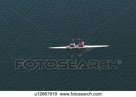 Stock Photo - Two people kayaking. Fotosearch