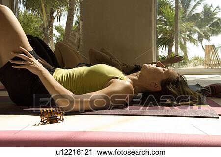 Stock Image - Woman in yoga position. Fotosearch