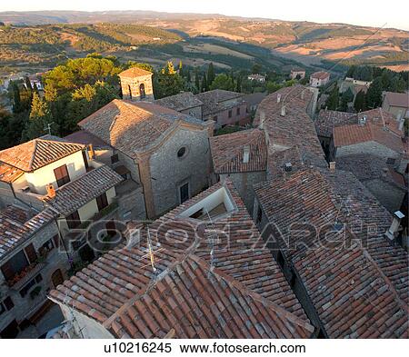 Aerial landscape view of Montecastello di Vibio at sunrise, showing Piazza Garibaldi and church of Santa Illuminata, valley, roof tops, View Large Photo Image Stock Photography - Aerial landscape view of Montecastello di Vibio at sunrise, showing Piazza Garibaldi and church of Santa Illuminata, valley, roof tops, . Fotosearch