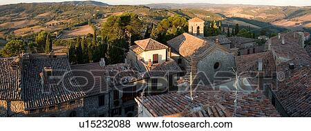 Aerial panorama view of Montecastello di Vibio, at sunrise, showing Piazza Garibaldi and church of Santa Illuminata, valley, roof tops, View Large Photo Image Stock Photo - Aerial panorama view of Montecastello di Vibio, at sunrise, showing Piazza Garibaldi and church of Santa Illuminata, valley, roof tops, . Fotosearch