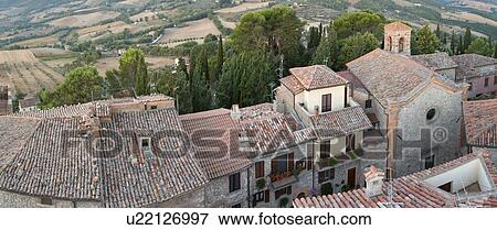 Aerial panorama view of Montecastello di Vibio, showing Piazza Garibaldi and church of Santa Illuminata, valley, roof tops, View Large Photo Image Stock Photo - Aerial panorama view of Montecastello di Vibio, showing Piazza Garibaldi and church of Santa Illuminata, valley, roof tops, . Fotosearch