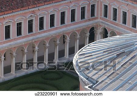 Stock Image - Aerial view of cloister of San Giorgio Maggiore with ornamental gardens and detail of dome. Fotosearch