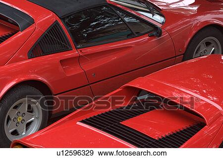 Aerial view of parked red Ferraris,, on cloudy rainy day View Large Photo Image Stock Photo - Aerial view of parked red Ferraris,, on cloudy rainy day. Fotosearch