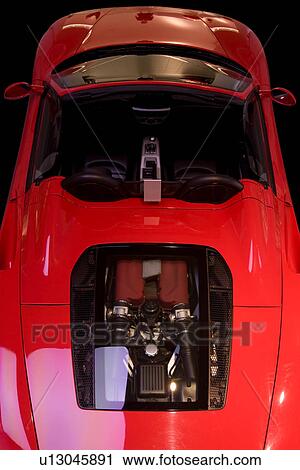 Aerial view of red Ferrari sports car convertible, with engine visble through transparent panel View Large Photo Image Stock Image - Aerial view of red Ferrari sports car convertible, with engine visble through transparent panel. Fotosearch