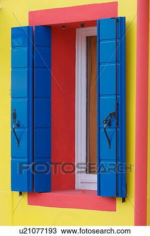 Blue shutters and red trimmed window on yellow house in Burano, Venice Lagoon Italy View Large Photo Image Stock Image - Blue shutters and red trimmed window on yellow house in Burano, Venice Lagoon Italy. Fotosearch