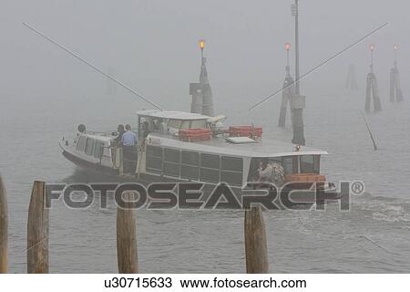 Boat in motion in early morning fog, summer View Large Photo Image Stock Image - Boat in motion in early morning fog, summer. Fotosearch