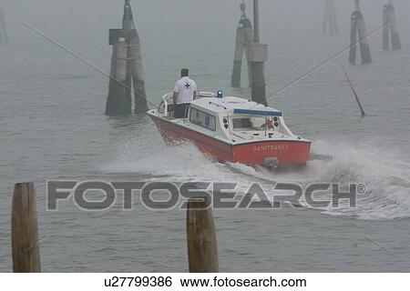 Stock Photograph - Boat in motion in morning fog. Fotosearch