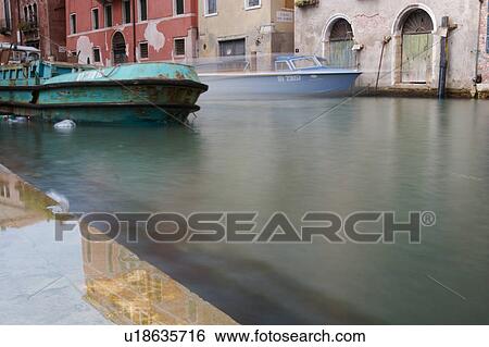 boats in motion on canal with building reflection View Large Photo Image Stock Photograph - boats in motion on canal with building reflection. Fotosearch