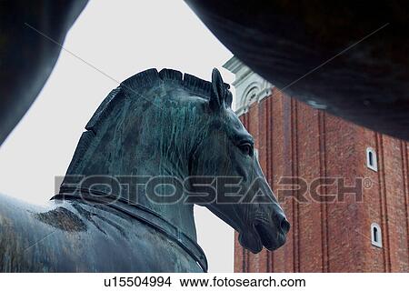 Picture - Bronze horses on front of Basilica San Marco (St Marks Basilica) with Campanile in background. Fotosearch