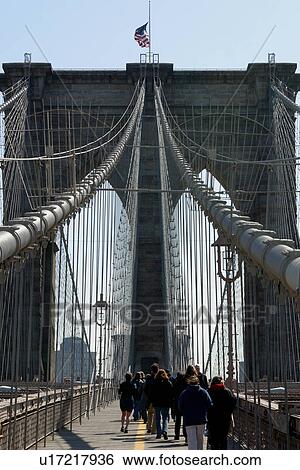 Brooklyn Bridge, view of pedestrian walkway, with pedestrians on winter morning View Large Photo Image Stock Photograph - Brooklyn Bridge, view of pedestrian walkway, with pedestrians on winter morning. Fotosearch