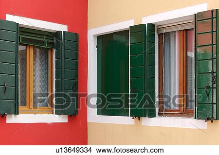 Picture - Burano brightly painted walls and windows. Fotosearch