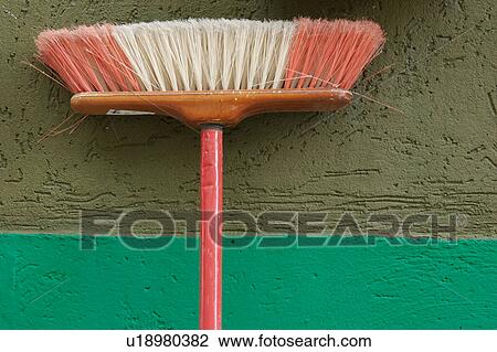 Burano: broom propped against brightly painted green wall View Large Photo Image Stock Image - Burano: broom propped against brightly painted green wall . Fotosearch