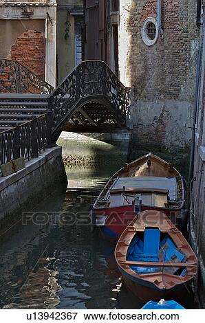 canal with reflection of buildings and boats moored View Large Photo Image Stock Photo - canal with reflection of buildings and boats moored. Fotosearch