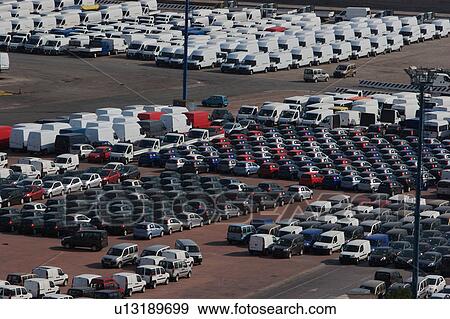 Cars and vans awaiting shipment on quayside View Large Photo Image Stock Photo - Cars and vans awaiting shipment on quayside. Fotosearch