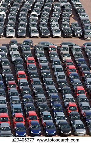 Stock Photo - Cars and vans awaiting shipment on quayside. Fotosearch
