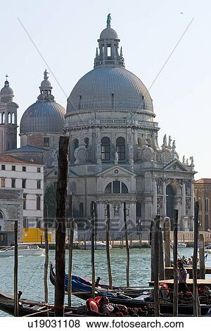 Church of Santa Maria della Salute with gondolas moored in foreground View Large Photo Image Stock Photo - Church of Santa Maria della Salute with gondolas moored in foreground. Fotosearch