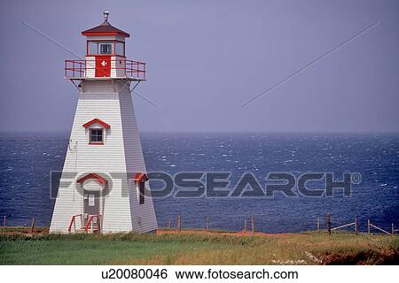 Cliff lighthouse against sky, with sea beyond View Large Photo Image Stock Photograph - Cliff lighthouse against sky, with sea beyond. Fotosearch