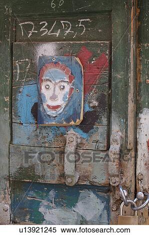 Close up of painted wooden door with painted clown mask View Large Photo Image Stock Photography - Close up of painted wooden door with painted clown mask . Fotosearch