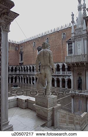 Colonnade of inside courtyard of Doges Palace in rain with sculptured Giant at top of Giants Staircase View Large Photo Image Stock Photo - Colonnade of inside courtyard of Doges Palace in rain with sculptured Giant at top of Giants Staircase. Fotosearch