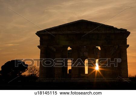 Stock Photography - Cyclist in front of Cattedrale on cobble stone street. Fotosearch