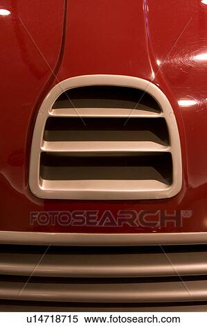 Stock Photography - Detail of antique red Ferrari, front view, with silver grille. Fotosearch
