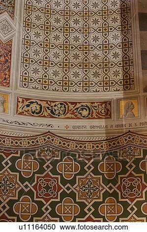 Stock Image - detail of apse decorated stonework, painted with geometric designs, floral motifs and garlands . Fotosearch