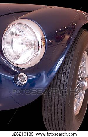 Detail of blue antique Ferrari convertible, showing front headlight and wheel, View Large Photo Image Stock Image - Detail of blue antique Ferrari convertible, showing front headlight and wheel,. Fotosearch