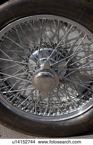 Detail of chrome wire spoked wheel with knock off hub View Large Photo Image Picture - Detail of chrome wire spoked wheel with knock off hub. Fotosearch